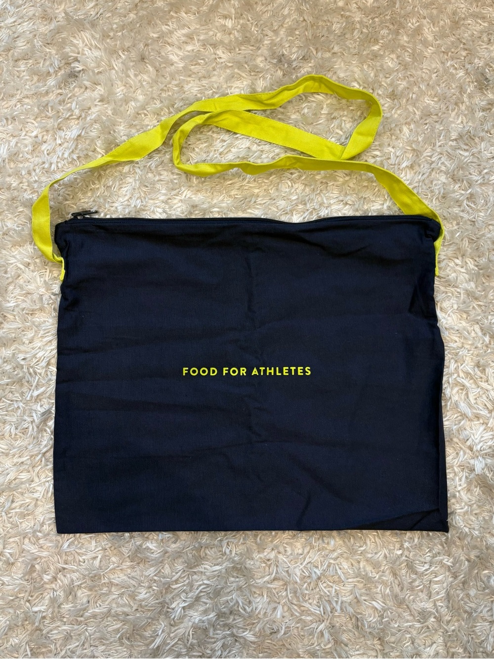The Feed Food for Athletes Navy Blue Zip Tote with Neon Yellow Green Long Strap